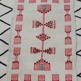 Traditional handmade white and red carpet