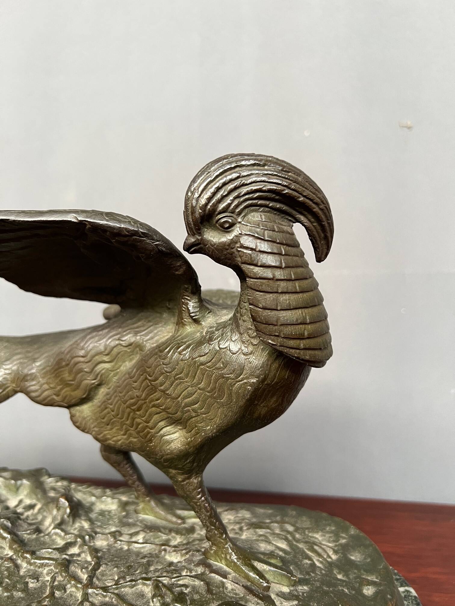 Rene Andre Varnier. Bronze figure of a pheasant on a green marble base.