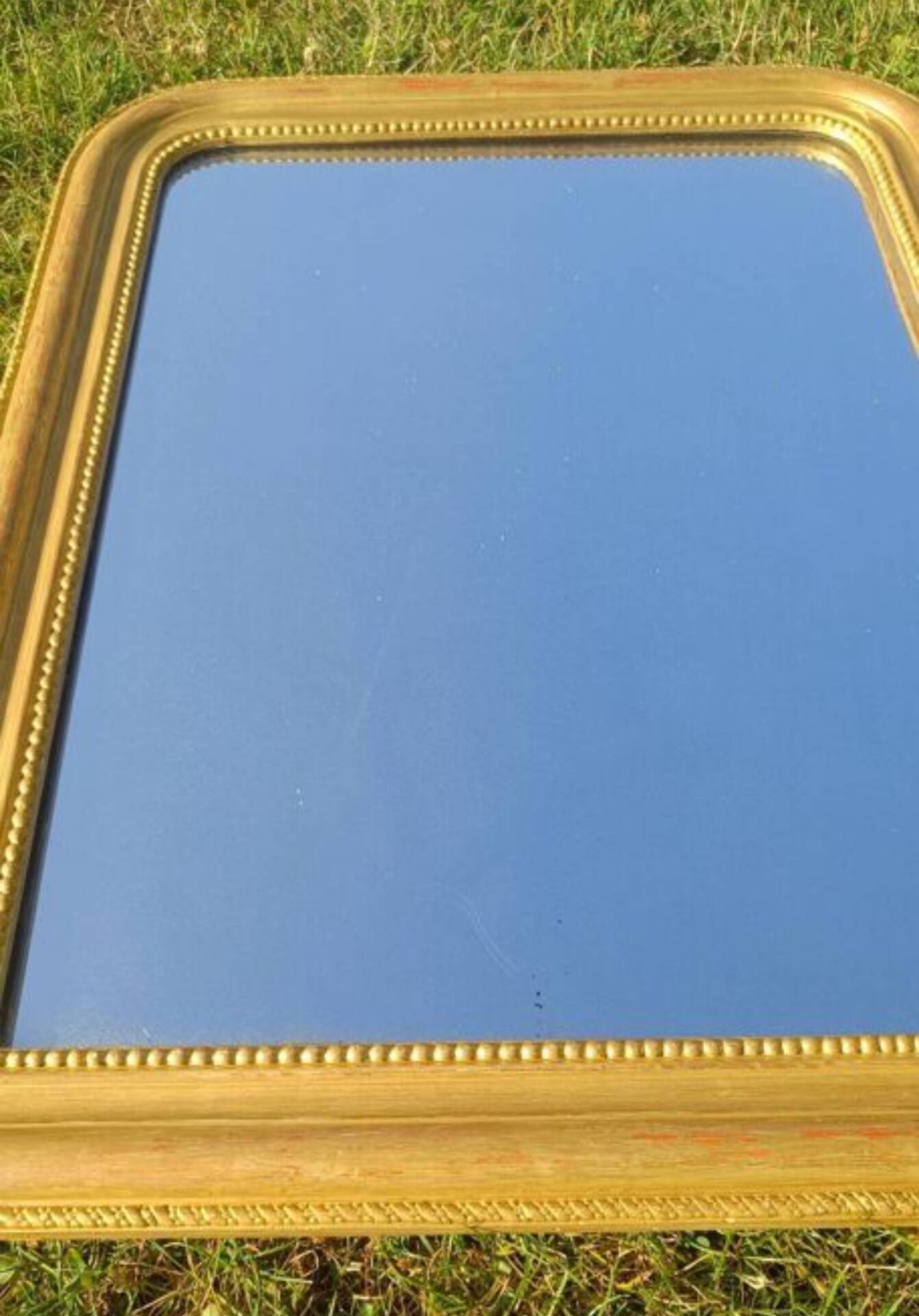 Antique Louis-Philippe mirror, gilded and patinated.