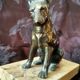 Greenhouse book dog sculpture regulates on marble slab