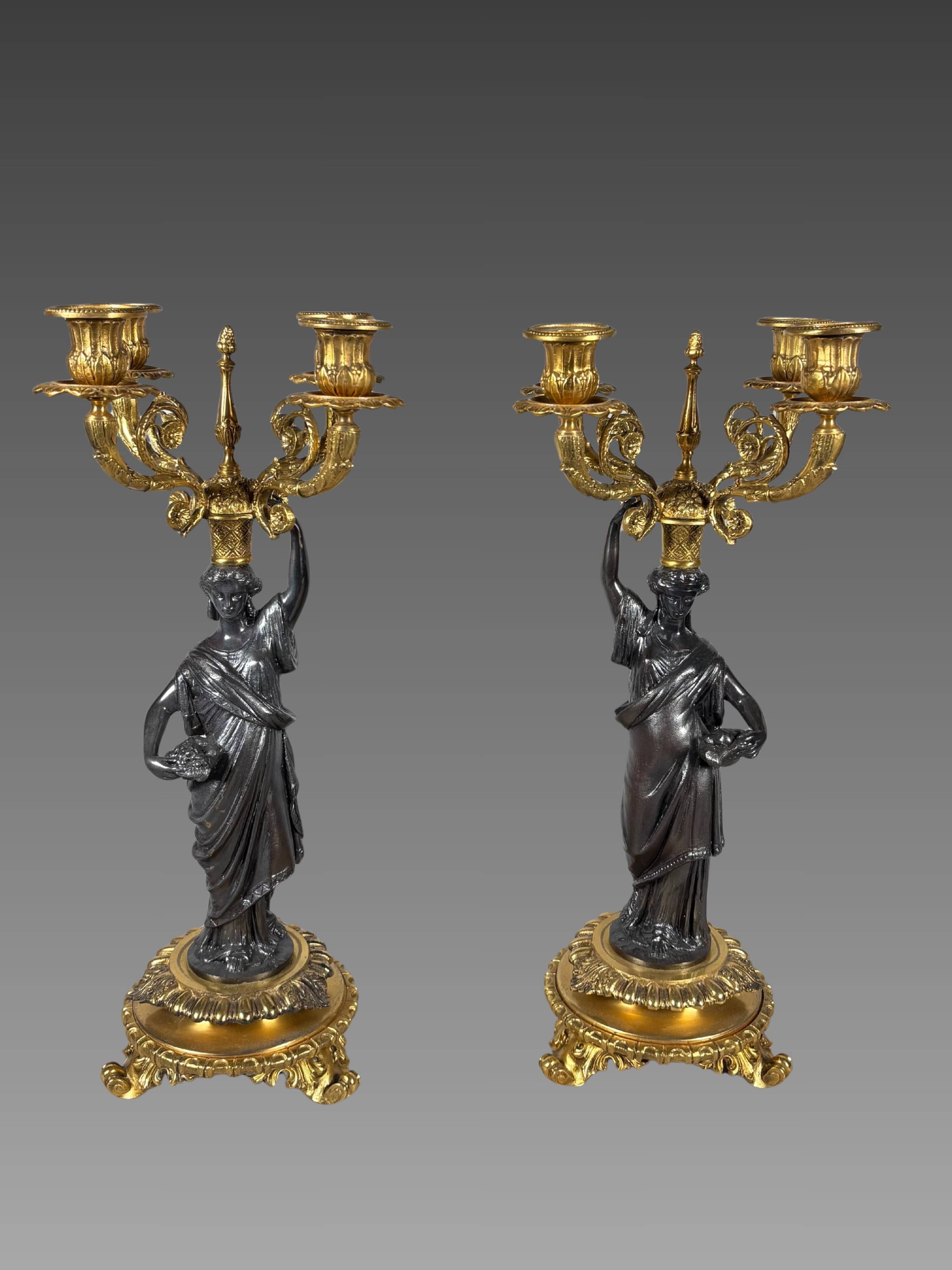 Pair of candelabra with women in the antique style of Napoleon III.