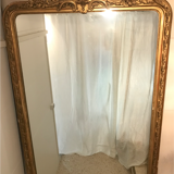 Large antique mirror with flagship shell in wood and gilded stucco