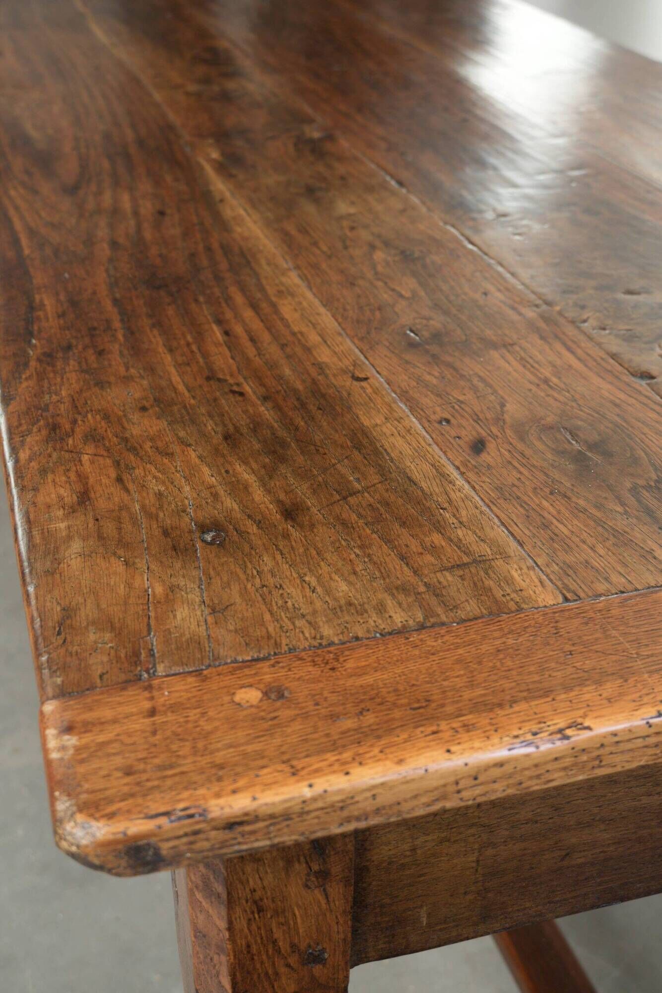 18th century French farmhouse dining table made of oak and fruitwood