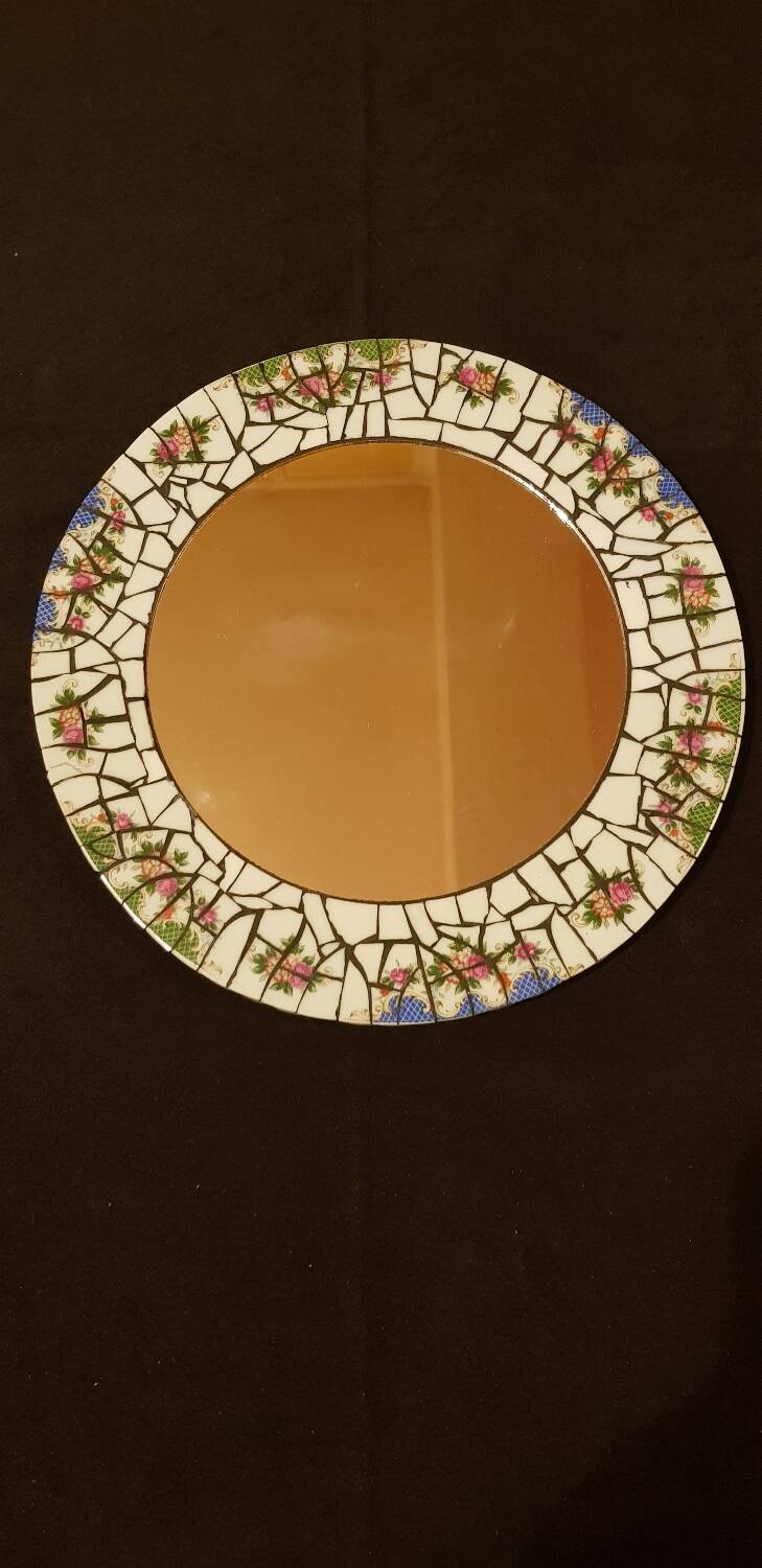 Ceramic mirror. Floral decor.