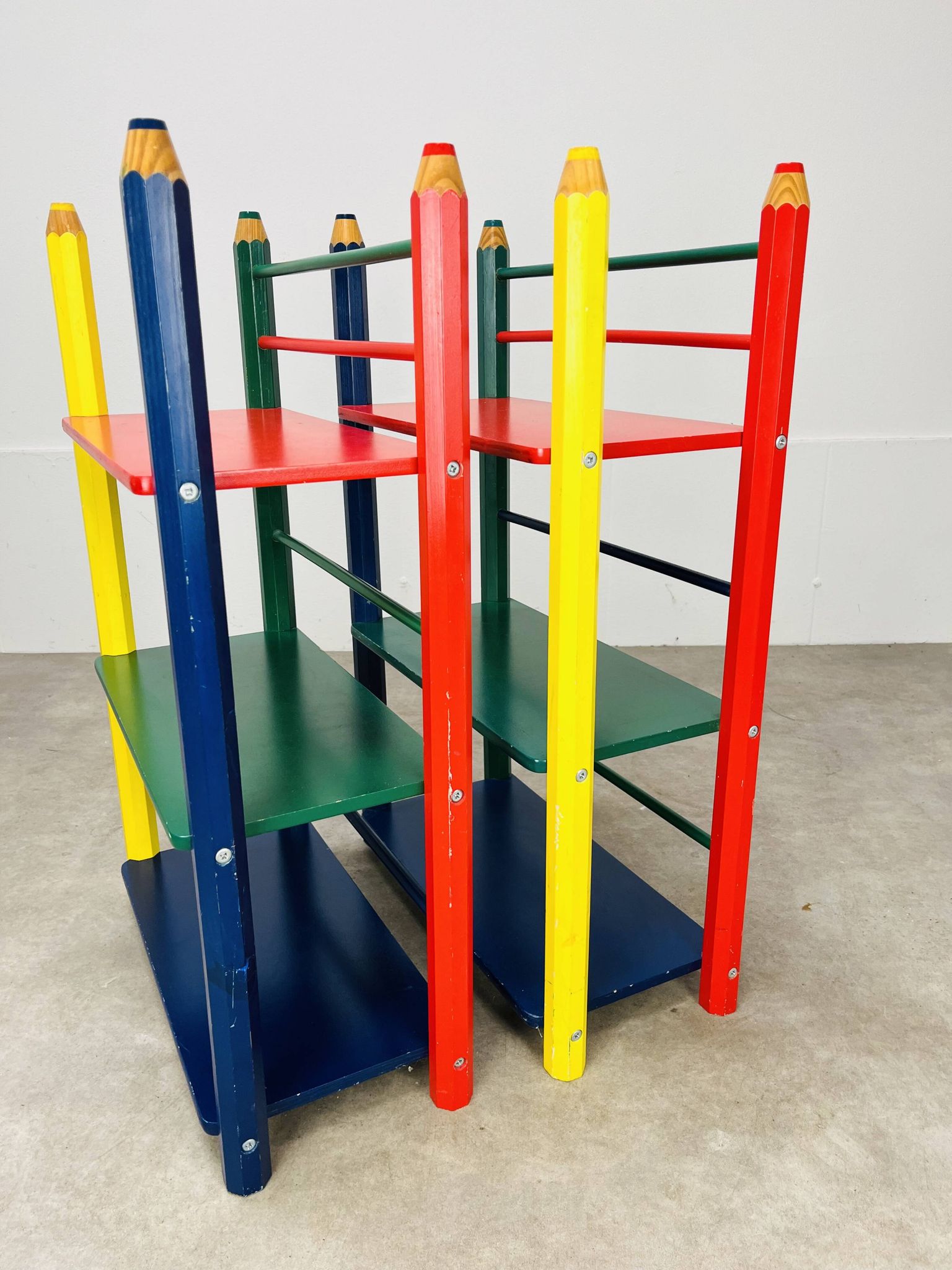 Pair of pencil-style shelves by Pierre Sala for children.