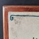 Vintage ceramic trivet – stylised floral design