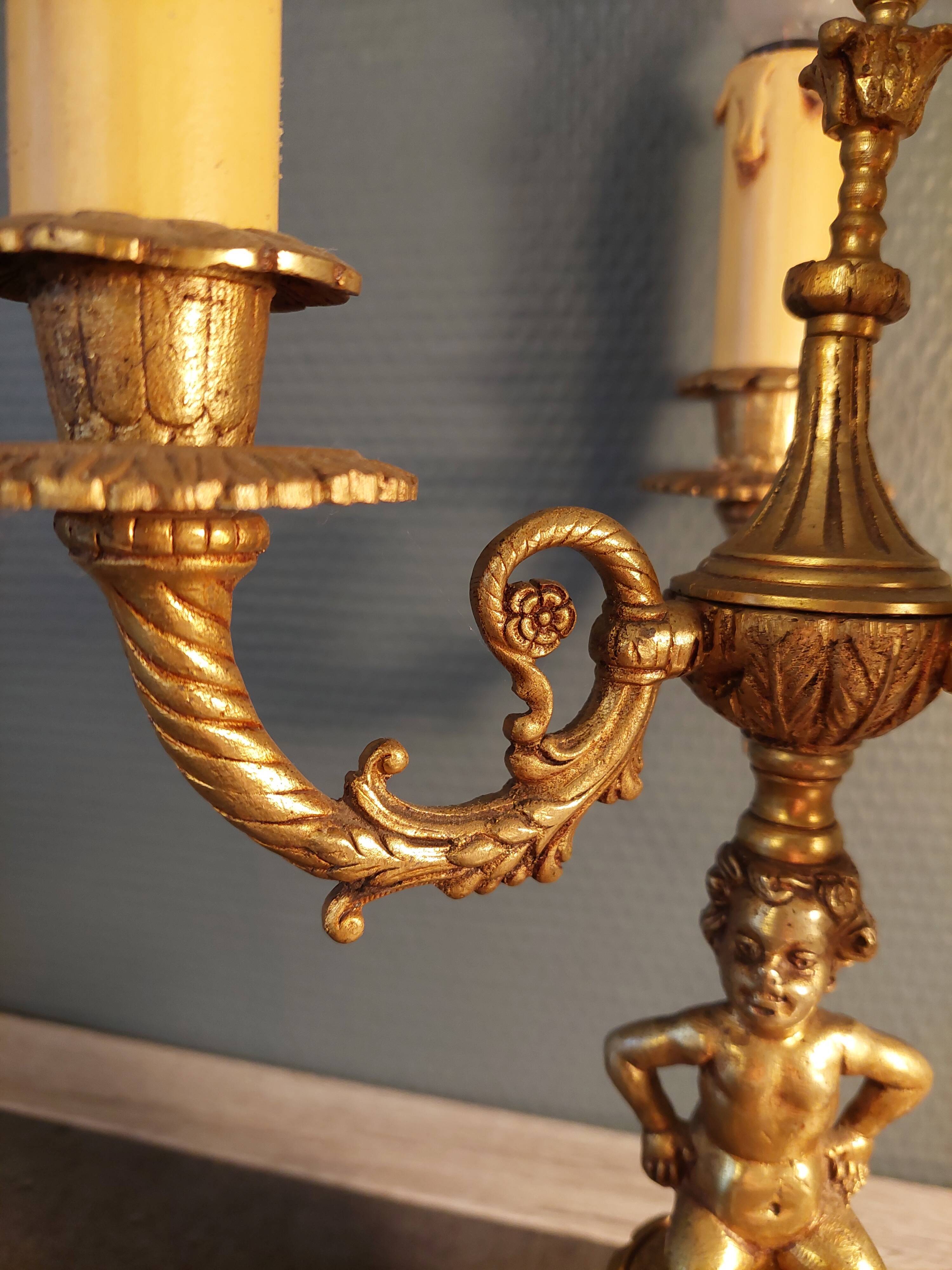 Electrified three-spoke brass candlesticks