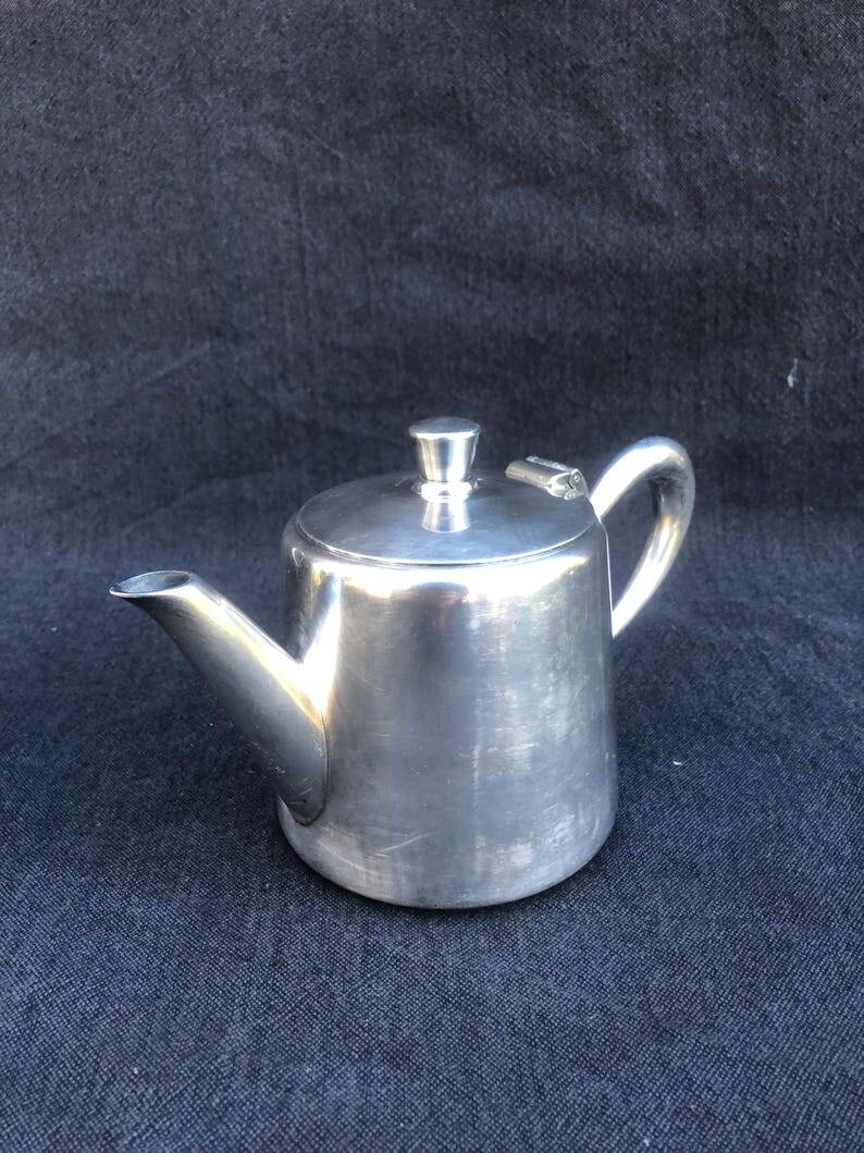 A pair of vintage silver-plated teapot and coffee pot