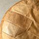 Pouf patchwork of natural cognac leather by De Sede, design 1970.