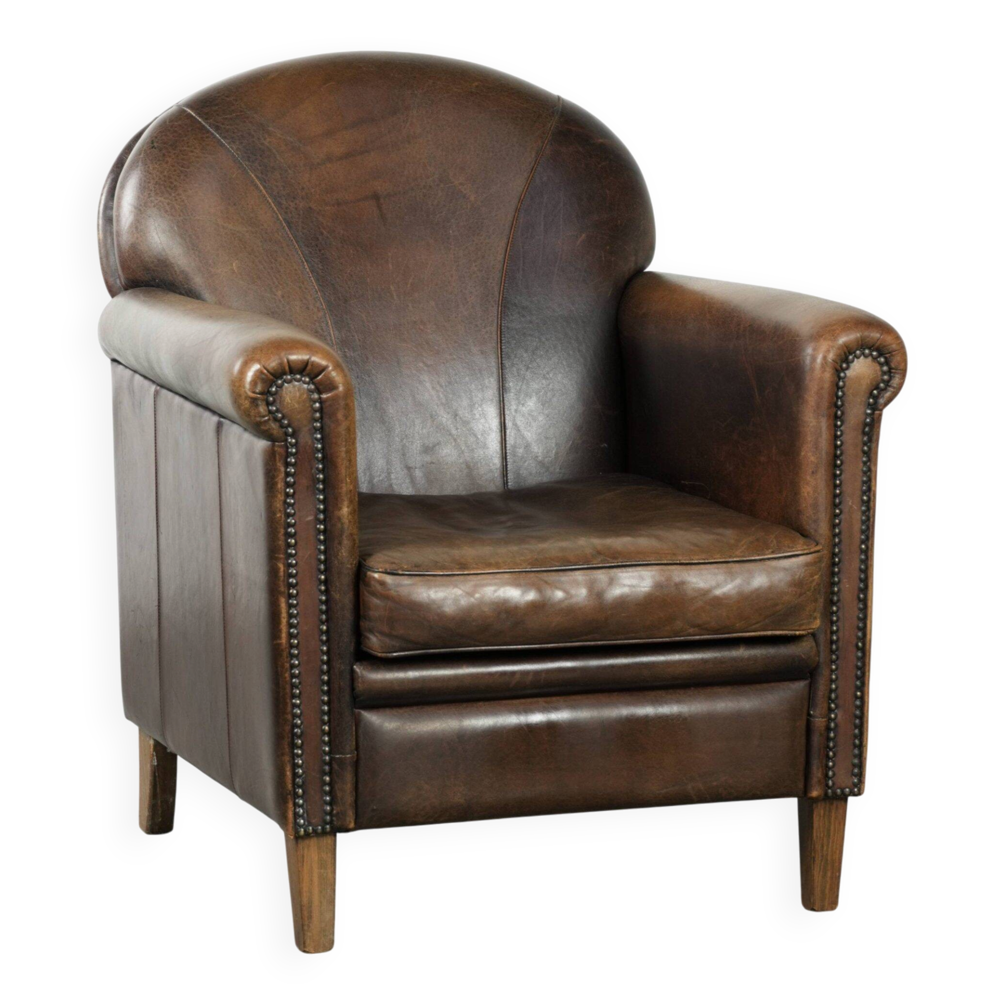 Armchair / lounge chair made of sheepskin leather with characterful patina