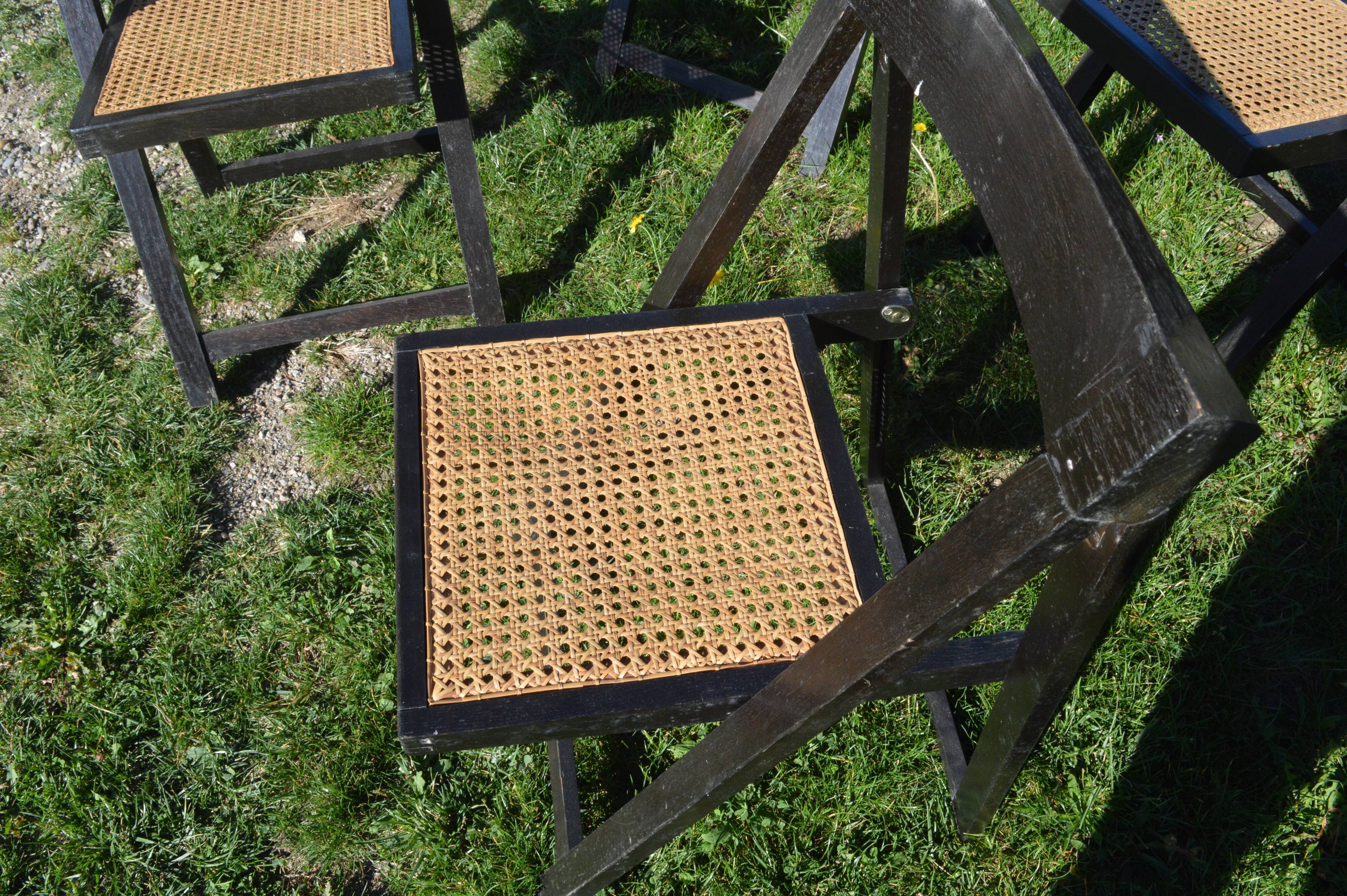 Suite of four folding chairs