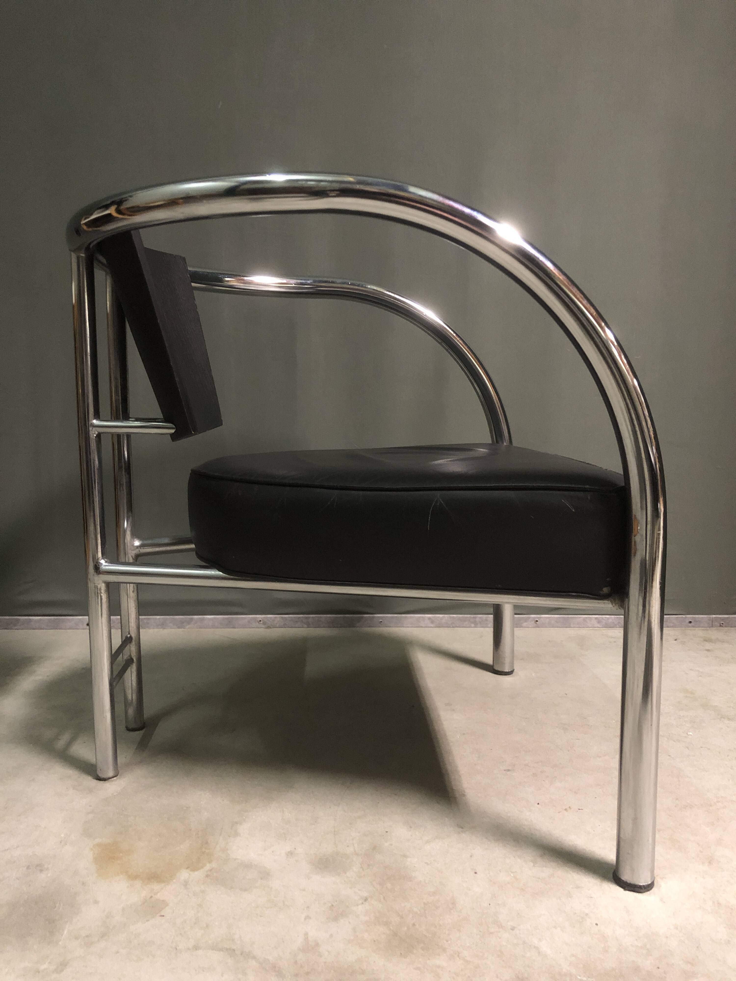 A pair of petite low armchairs by ronald cecil sportes for lumen center, 1987