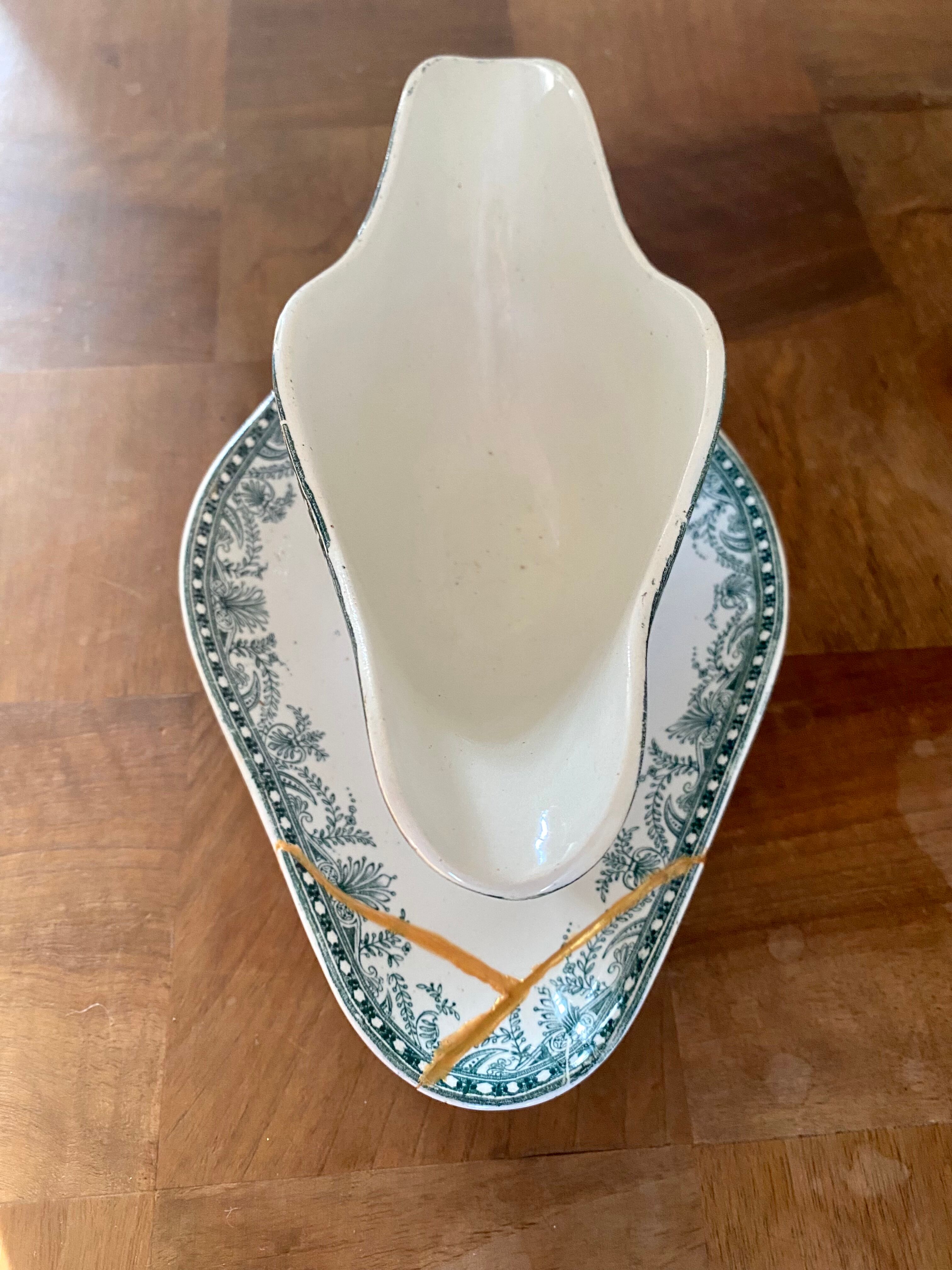 Old gravy boat repaired with the Japanese kintsugi technique