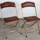 2 golden metal chairs with faux leather in the 60s/70s Opera style.