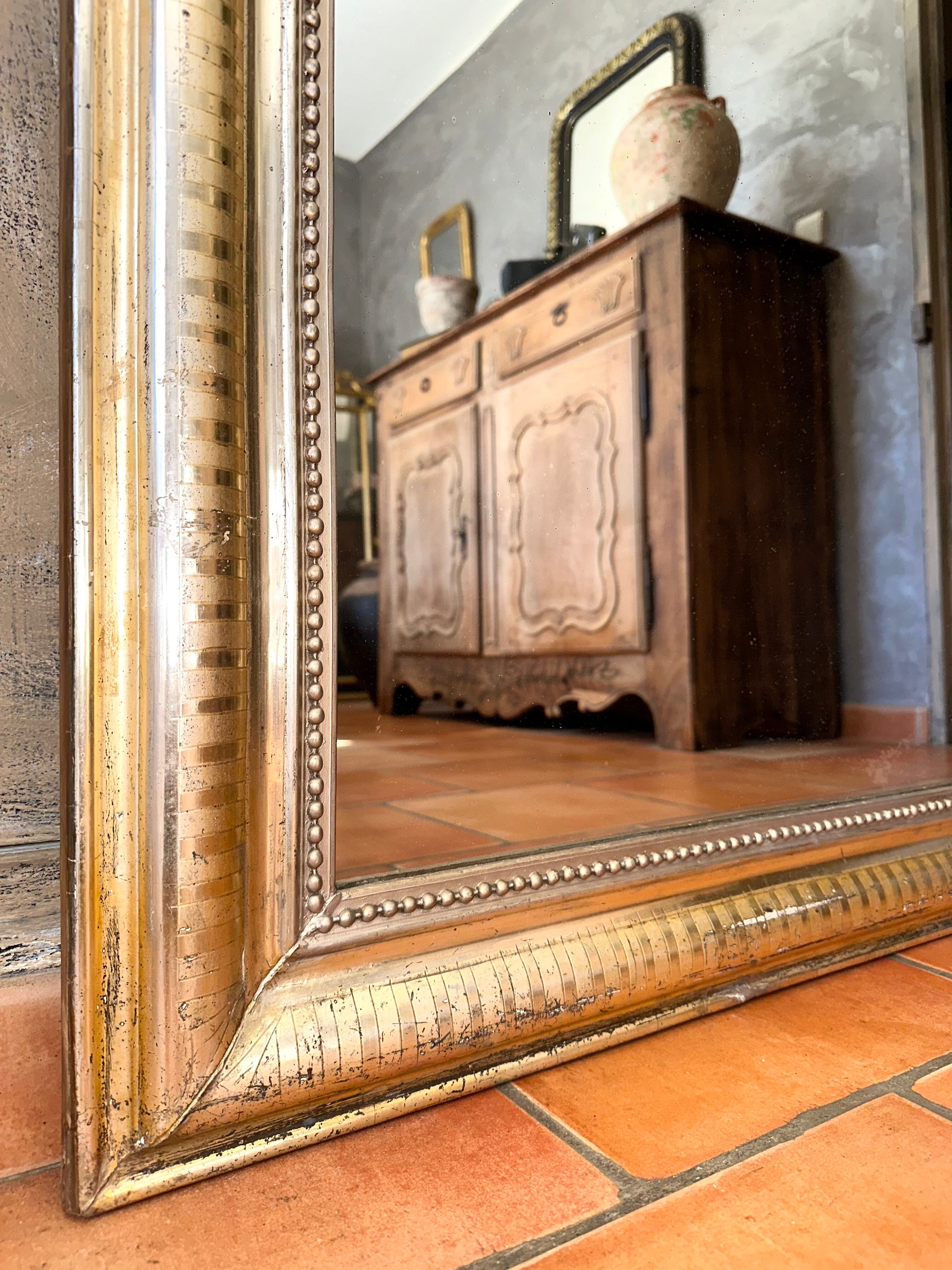 Louis-Philippe antique mirror with silver leaf, 19th century.