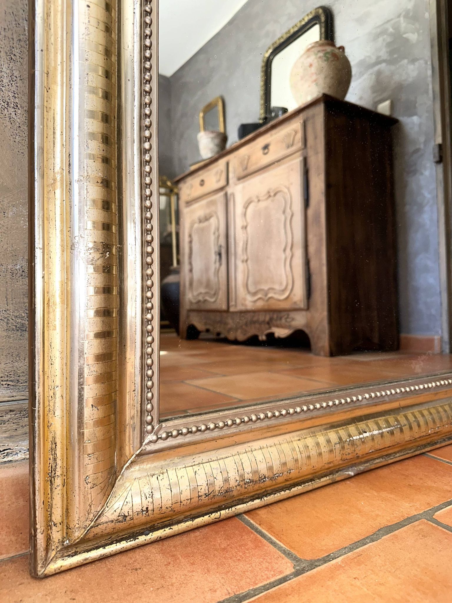 Louis-Philippe antique mirror with silver leaf, 19th century.