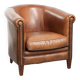 Sheepskin club armchair with a cognac colour finished with decorative nails