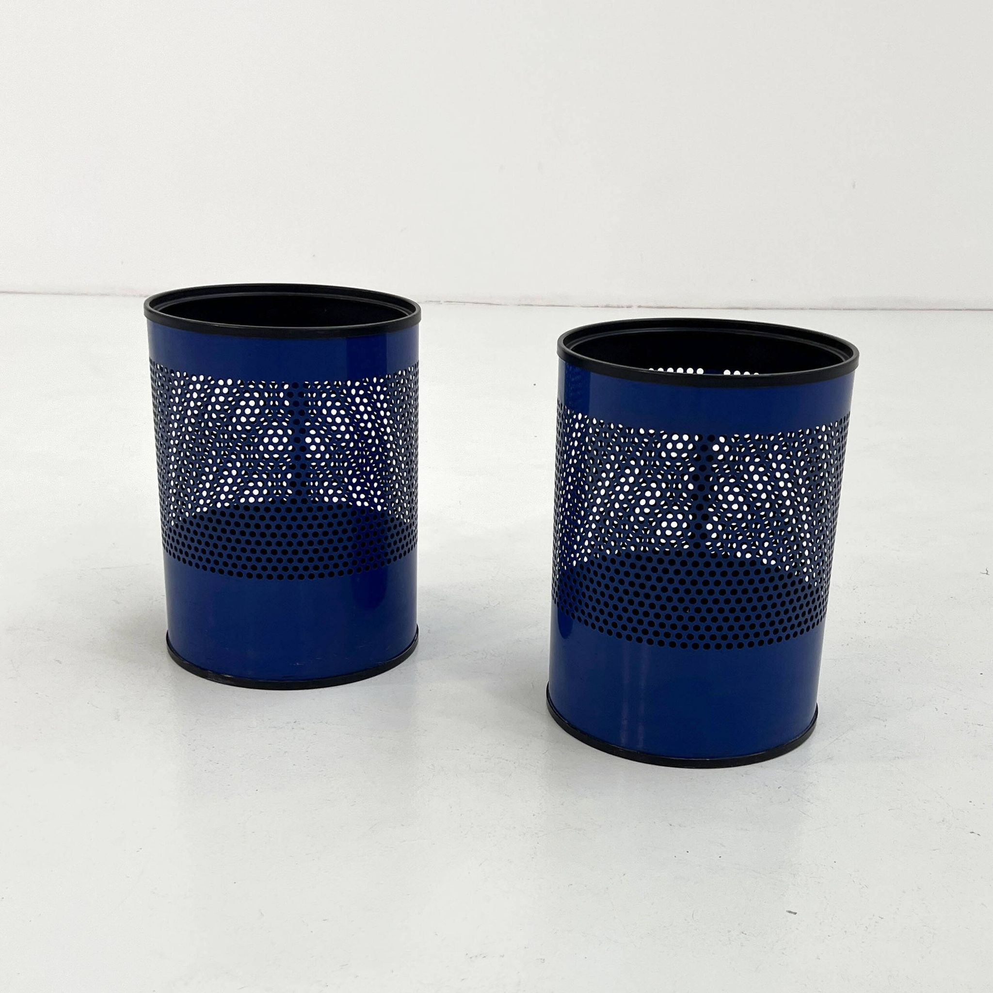 Blue perforated metal bin, 1980