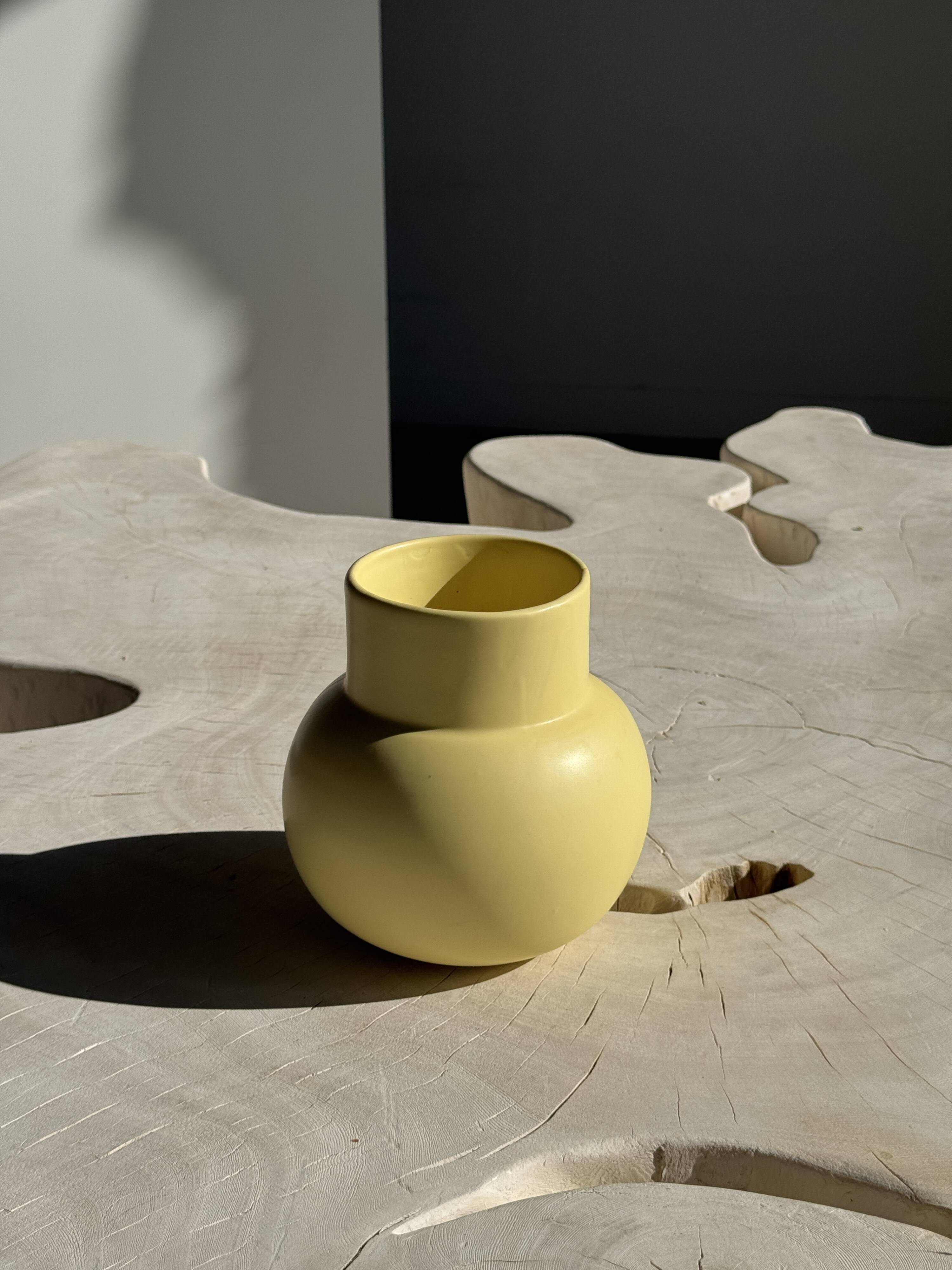 Small light yellow ball vase