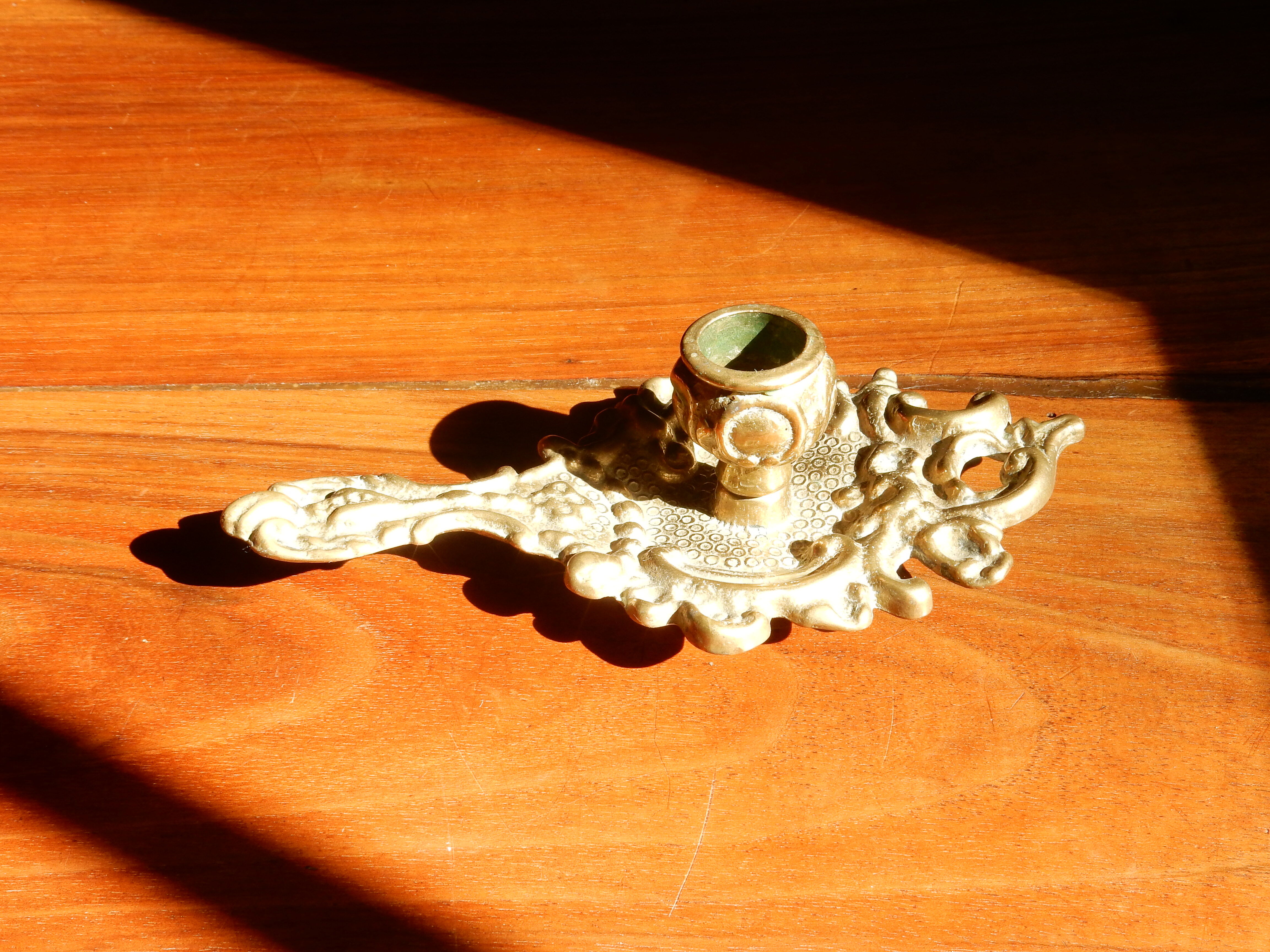 Bronze hand candle holder, cellar rat