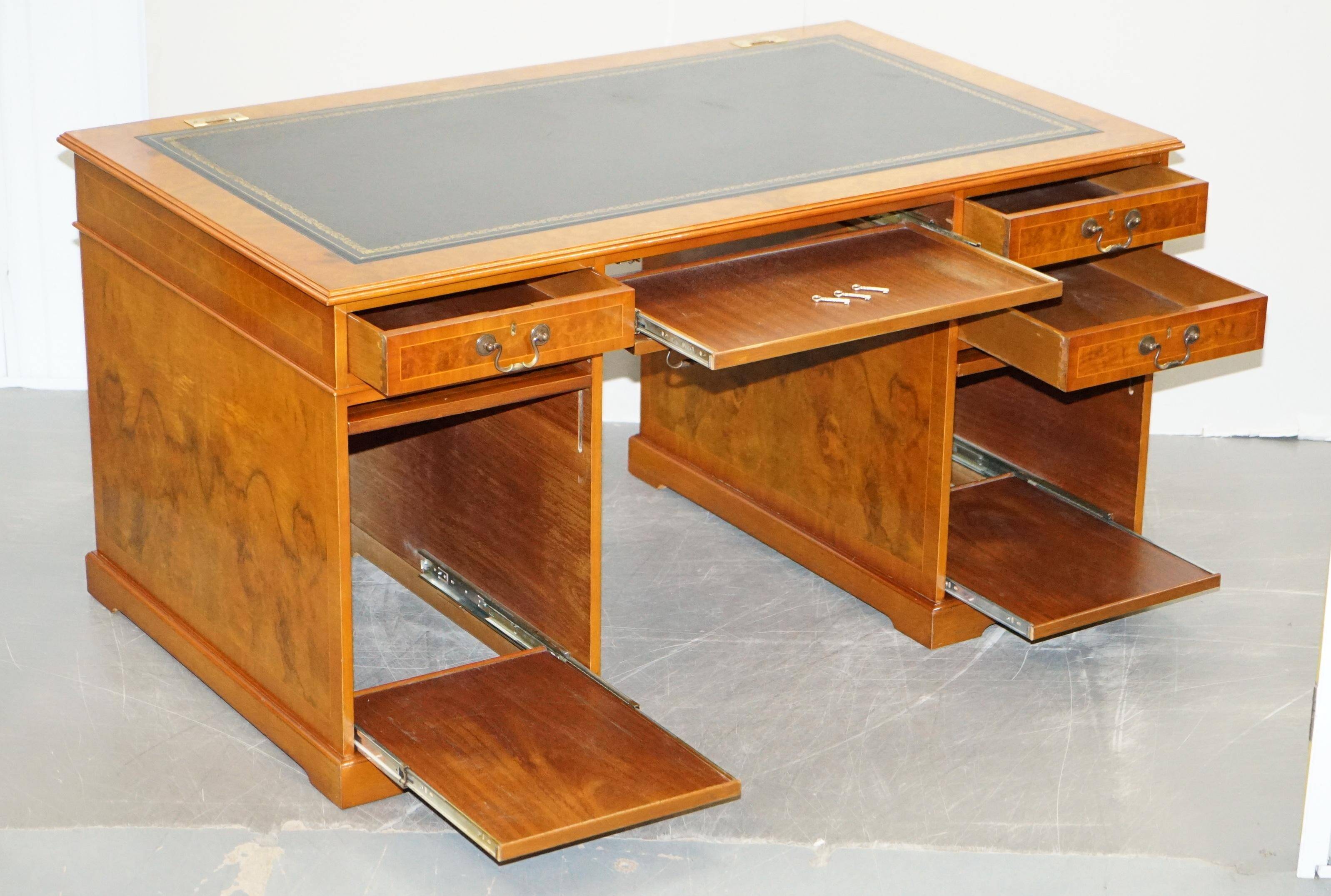 Partner desk in burr walnut designed to conceal computer equipment.