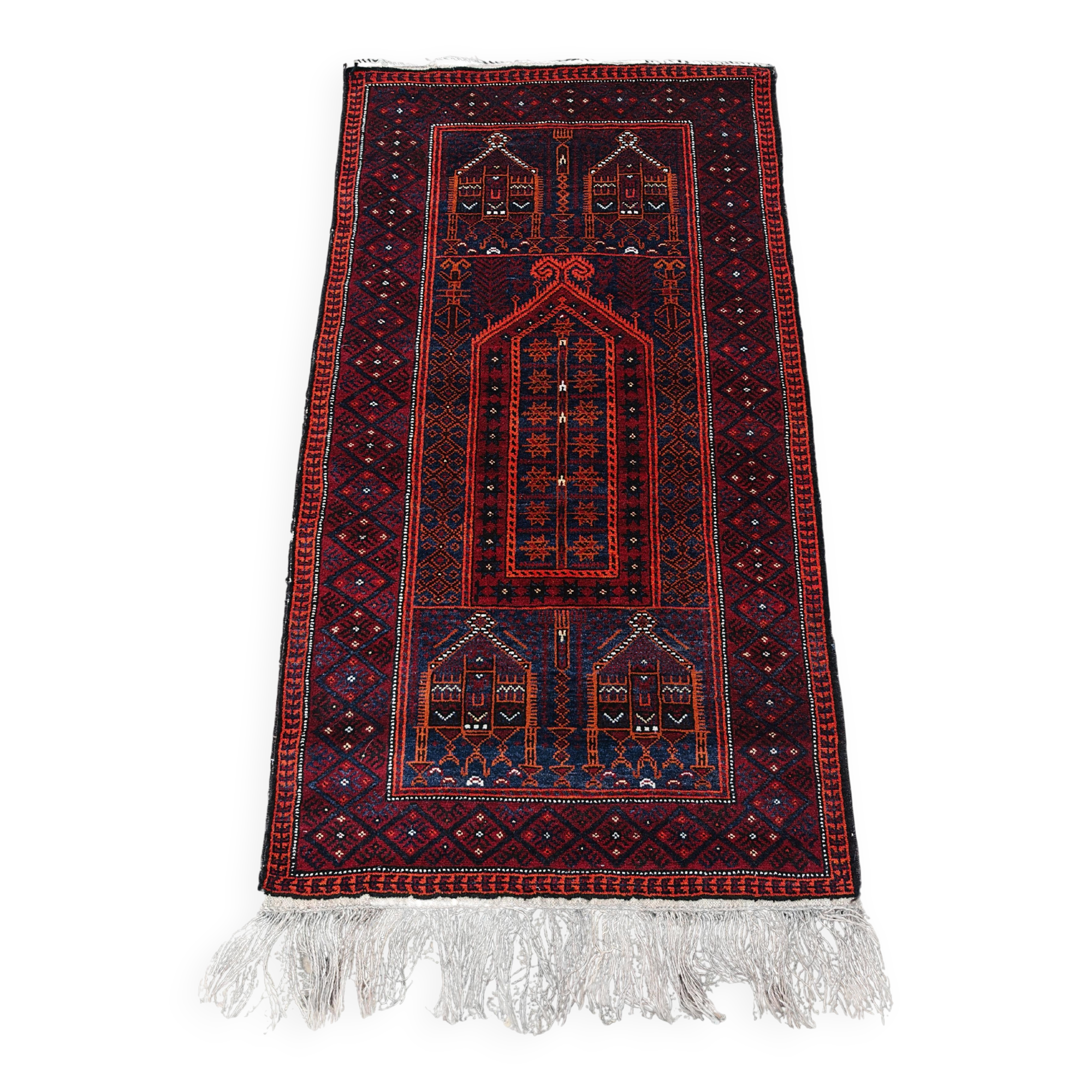 Vintage hand-knotted Persian Baluch prayer rug from the 1940s.
