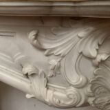 Louis XV style fireplace in white Carrara marble, 19th century