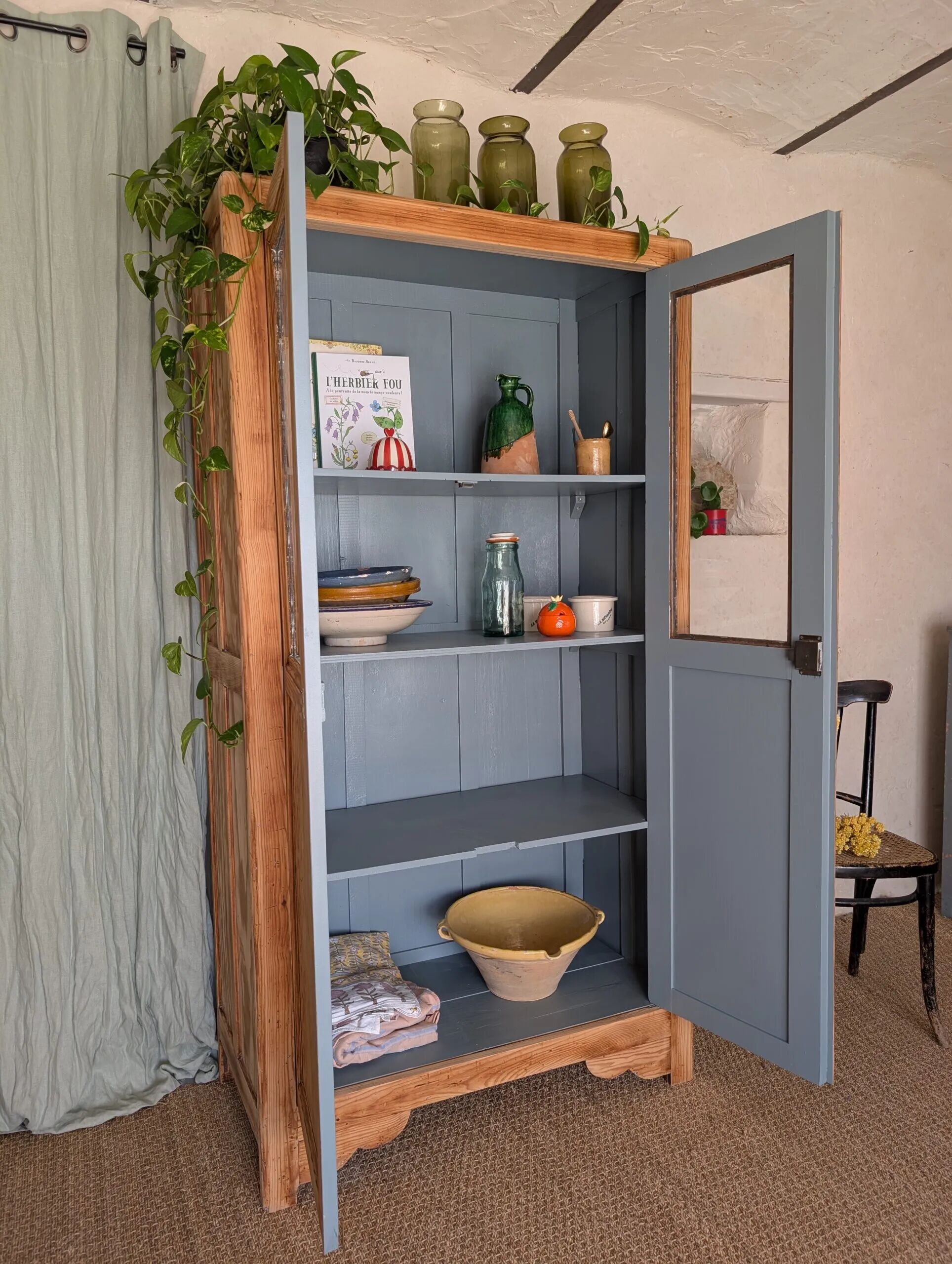 Old glass-fronted wooden library – blue interior