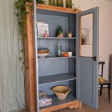 Old glass-fronted wooden library – blue interior