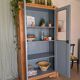 Old glass-fronted wooden library – blue interior