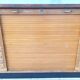 Workshop furniture with drawers and curtain in beech and walnut.