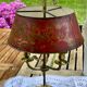 Bronze-gilt bouillotte lamp XIXth century with a tin shade featuring Japonese decoration.