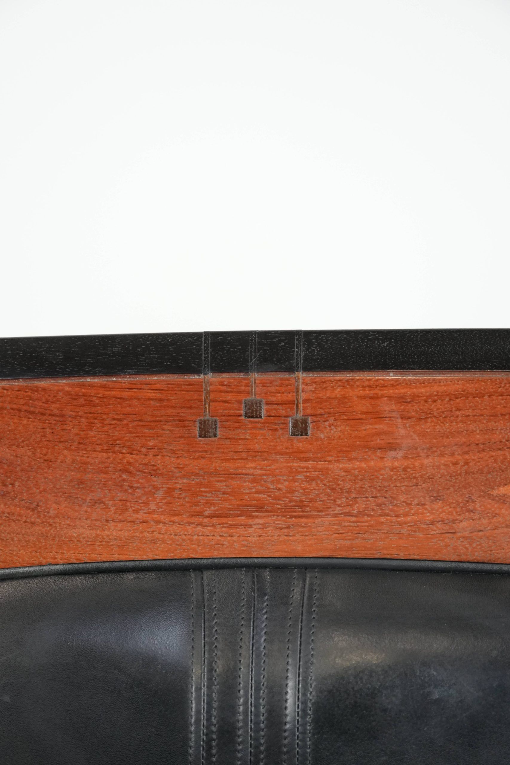 Black cowhide leather and wooden Art Deco design armchair