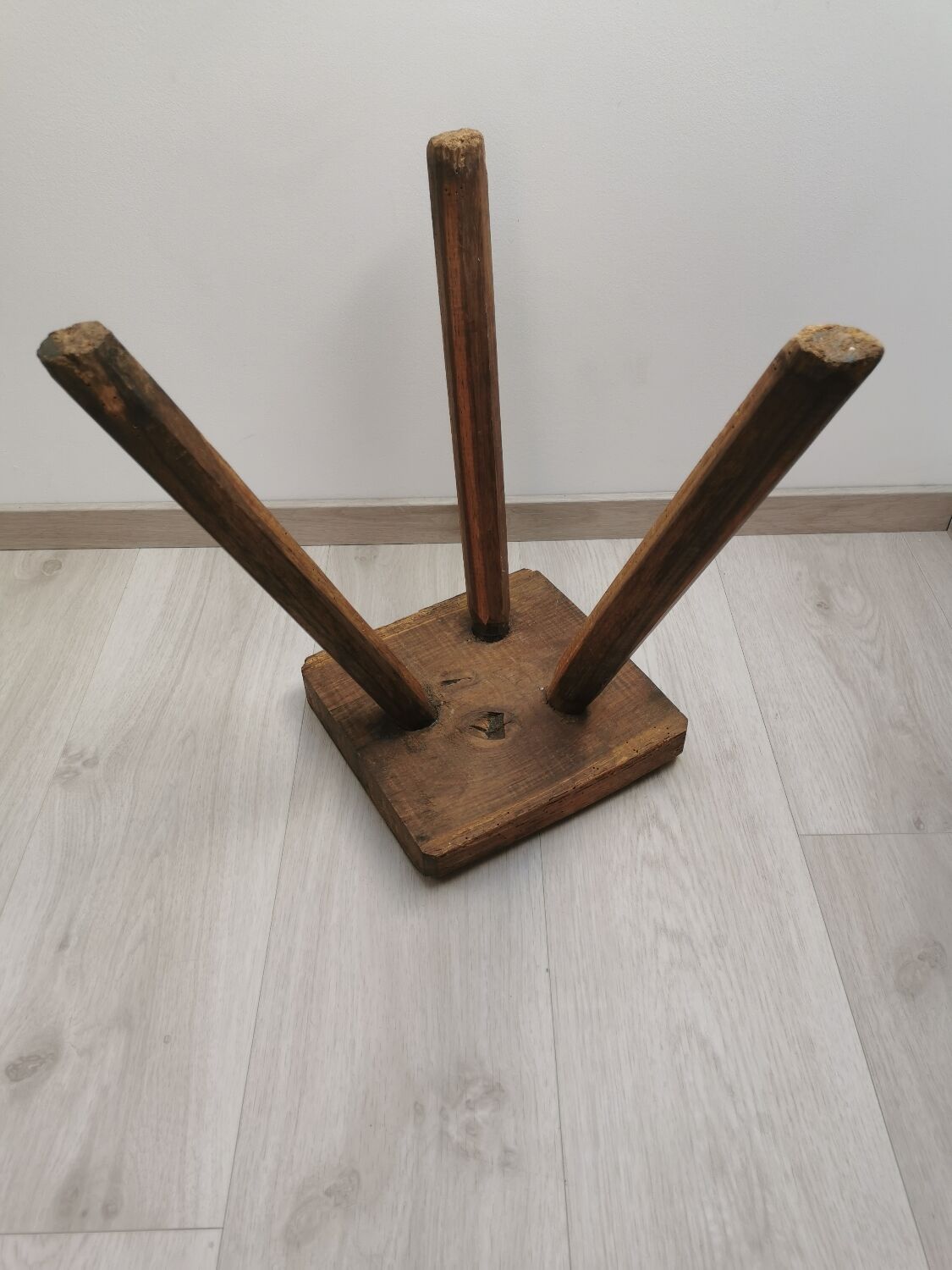 Old wooden stool tripods