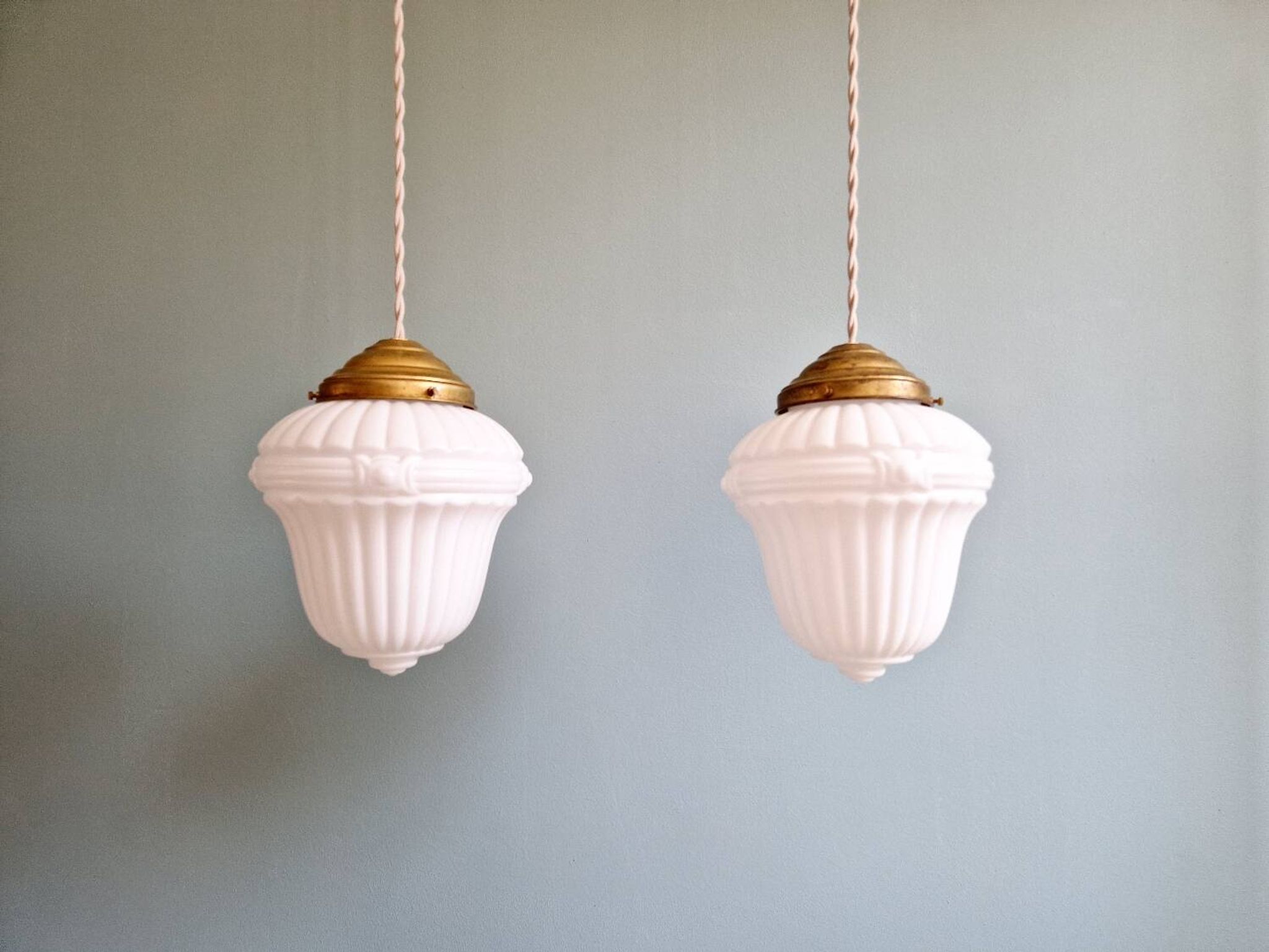 Pair of Art Deco pendant lights in pressed white opaline glass, 1920-30