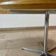 Dining table with a star-shaped six-legged base by Arne Jacobsen for Fritz Hansen.