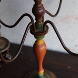 Old candlestick in painted wood and folding metal