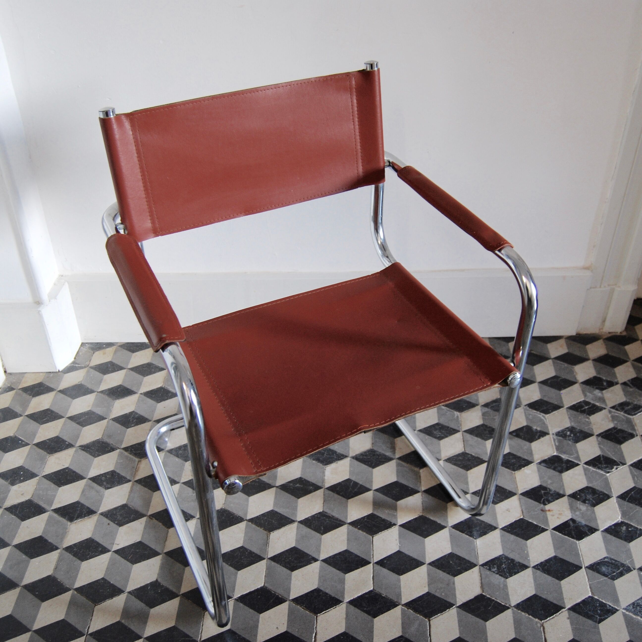 Vintage armchair in chrome and cognac leatherette