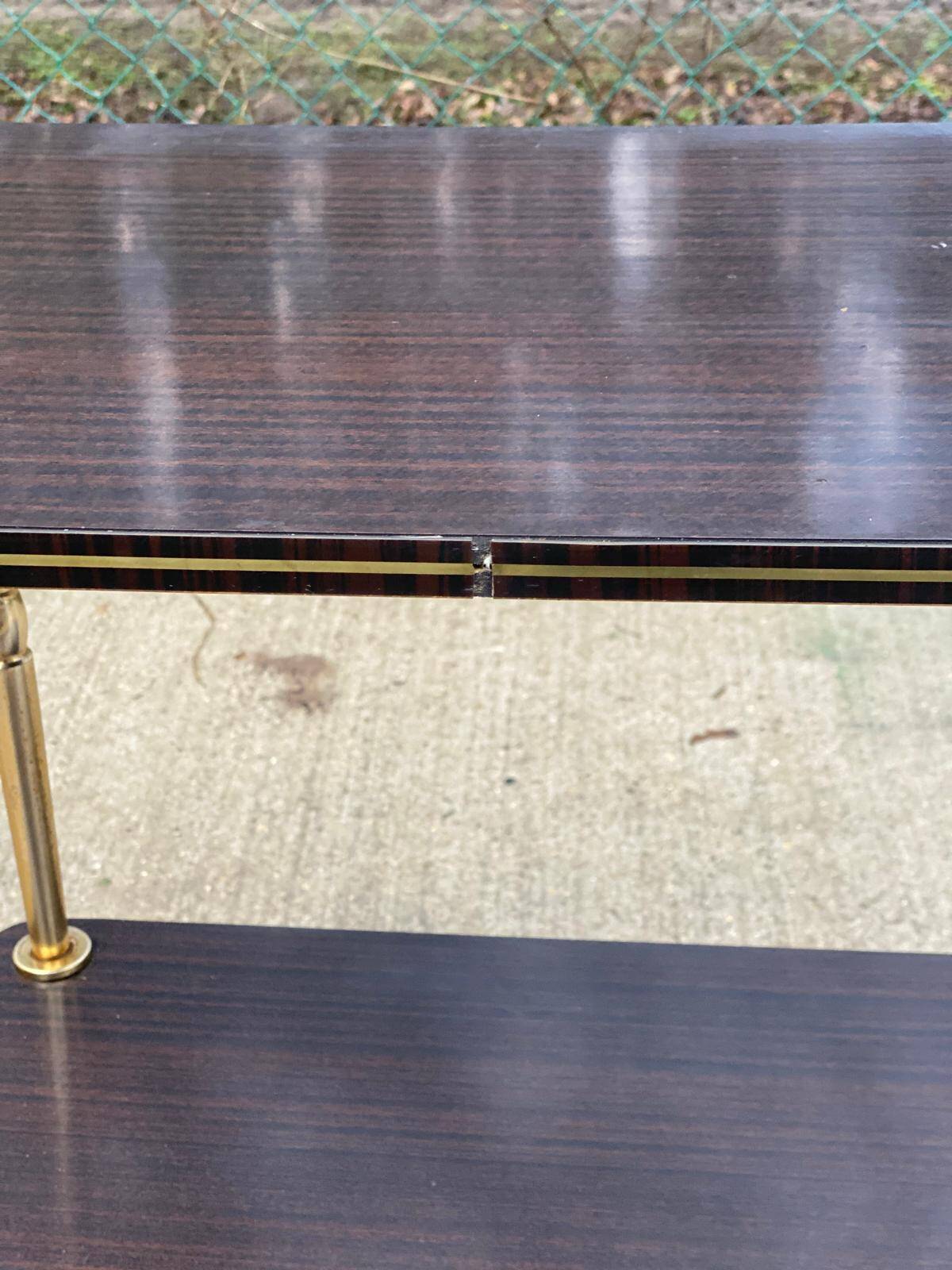 Brown rosewood rolling table with gold legs