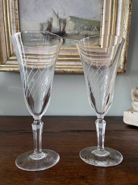 2 antique blown glass champagne flutes, tulip shape.