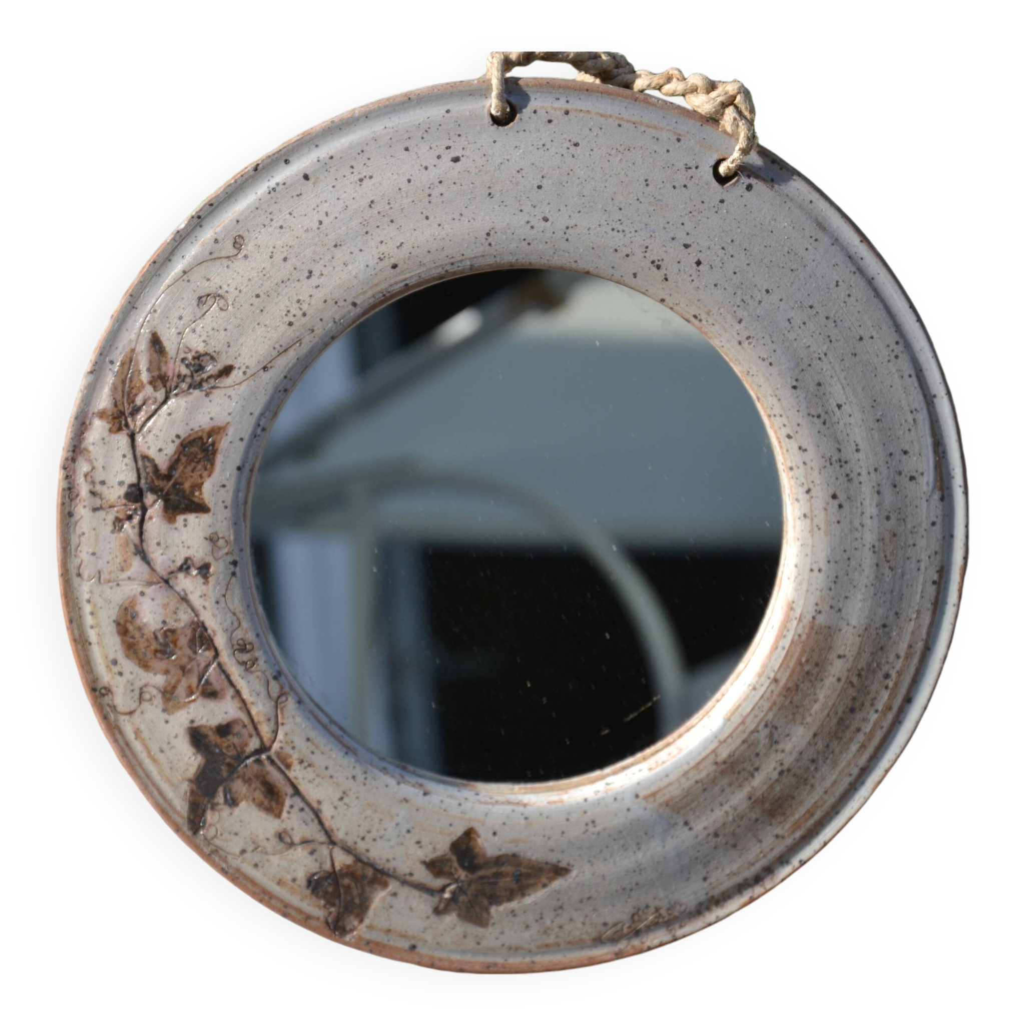 Miroir rond en céramique signé