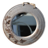 Round ceramic mirror signed