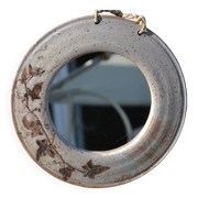 Miroir rond en céramique signé