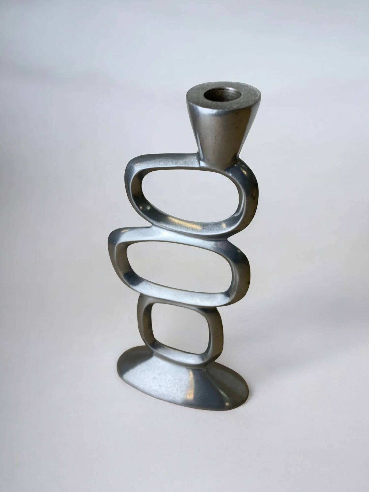 Circle candlestick by Matthew Hilton, solid aluminium, England, 1980s