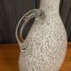 Pitcher vase in the shape of a gourd 1940 gray speckled on a white background