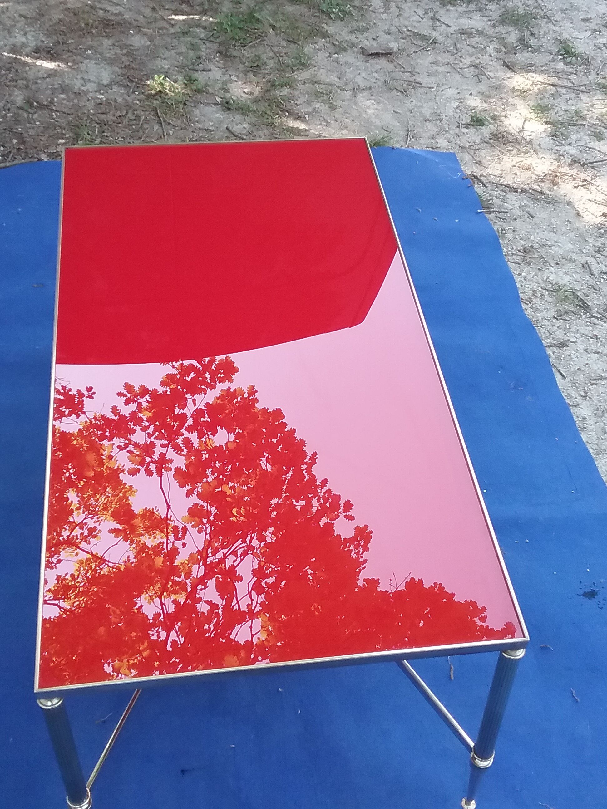 Brass coffee table with red glass top