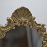Adjustable psyche mirror of 33 centimeters in gilded bronze with angel ornament