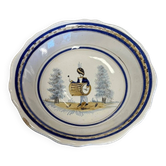 Large centrepiece table dish in earthenware with a painted decoration of a drummer.