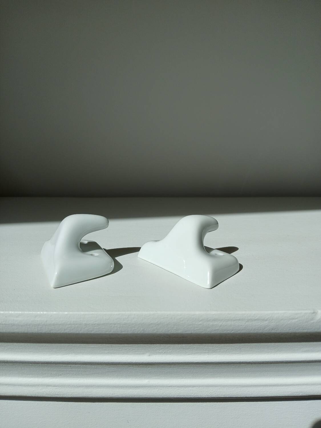Set of two porcelain tea towel holders