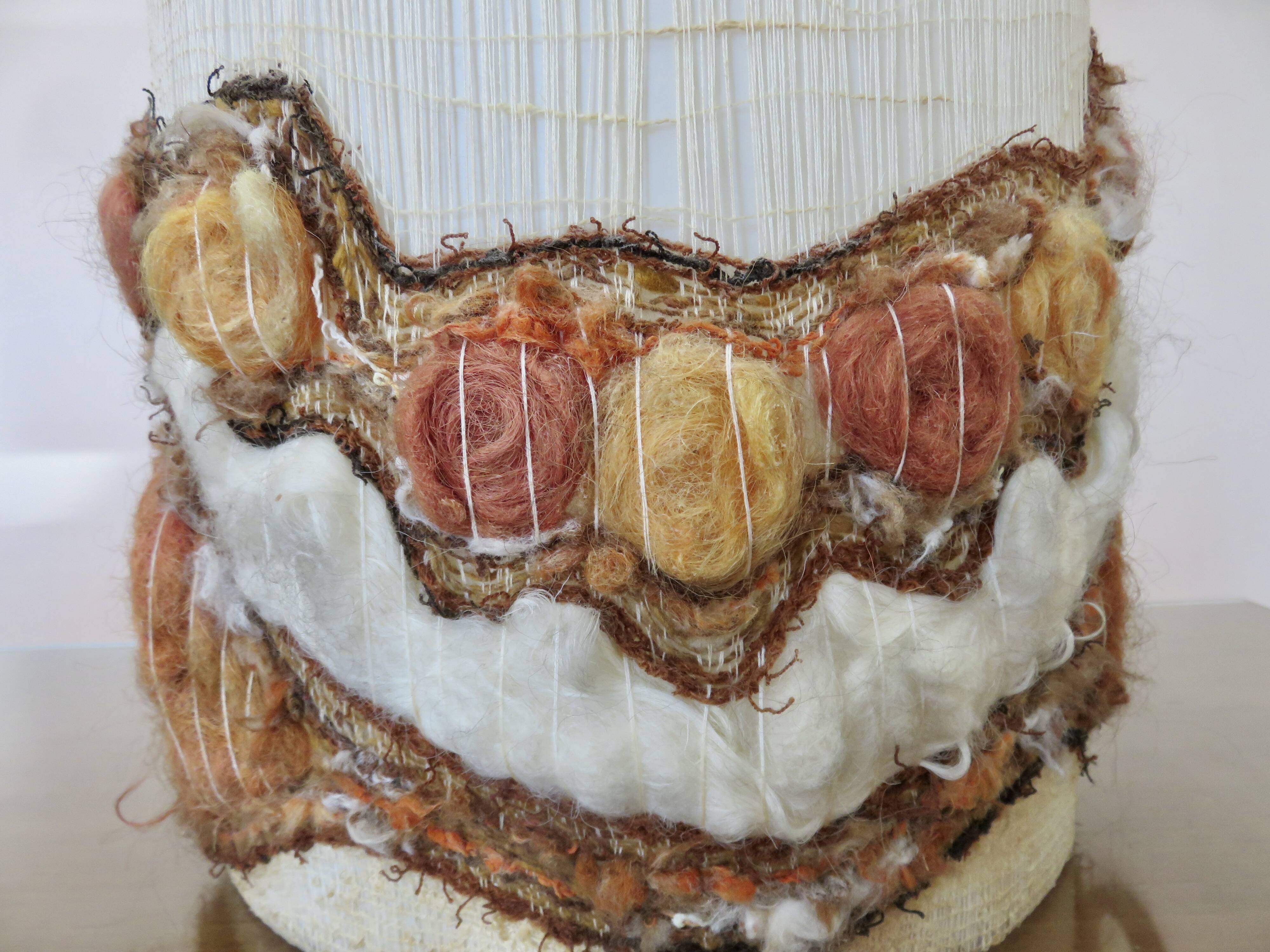 Ceramic lamp with double lighting and openwork design.